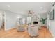 Cozy living room with hardwood floors, fireplace, and a stylish seating arrangement at 8 Bryncastle Ct, Durham, NC 27707