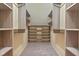 Custom walk-in closet with built-in shelving at 8 Bryncastle Ct, Durham, NC 27707
