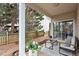 Cozy covered patio with seating, complemented by a well-maintained yard and decorative planters, ideal for entertaining at 8412 Lunar Stone Pl, Raleigh, NC 27613
