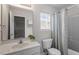 Well-lit bathroom featuring a shower/tub combination and vanity at 8412 Lunar Stone Pl, Raleigh, NC 27613