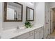 Bathroom with a double vanity, decorative mirrors, and updated fixtures at 8412 Lunar Stone Pl, Raleigh, NC 27613