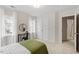 Bedroom featuring two windows, a bed, a desk and a chair at 8412 Lunar Stone Pl, Raleigh, NC 27613