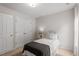 Neutral bedroom with a closet, a window with white curtains, and carpeted floors at 8412 Lunar Stone Pl, Raleigh, NC 27613