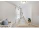 Bedroom with a play tent, fluffy rug, floral chair, and window at 8412 Lunar Stone Pl, Raleigh, NC 27613