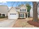 Charming two-story home with a well-manicured lawn and attached garage, perfect for a Gathering at 8412 Lunar Stone Pl, Raleigh, NC 27613