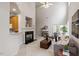 Bright living room featuring a fireplace, large windows, and modern decor, creating a cozy and inviting atmosphere at 8412 Lunar Stone Pl, Raleigh, NC 27613