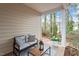 Covered patio with seating area, stylish furniture, and decorative flower pot at 8412 Lunar Stone Pl, Raleigh, NC 27613