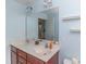 Well-lit bathroom featuring a double sink vanity with ample counter space and a large mirror at 9845 Sweet Basil Dr, Wake Forest, NC 27587