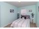 Cozy bedroom with a comfortable bed, decorative pillows, and stylish wall art at 9845 Sweet Basil Dr, Wake Forest, NC 27587
