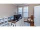 Functional home office features a desk setup, natural light, and ample storage at 9845 Sweet Basil Dr, Wake Forest, NC 27587
