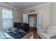 Bright home office space with a modern desk setup and comfortable seating area near the window at 9845 Sweet Basil Dr, Wake Forest, NC 27587