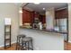 Open kitchen featuring granite countertops, stainless steel appliances, and breakfast bar at 9845 Sweet Basil Dr, Wake Forest, NC 27587