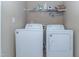 Laundry room with a washer and dryer. There is also an overhead wire rack at 9845 Sweet Basil Dr, Wake Forest, NC 27587