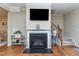 Inviting living room with fireplace, hardwood floors, and staircase at 9845 Sweet Basil Dr, Wake Forest, NC 27587