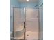 Modern shower featuring glass doors, a built-in seat, and a sleek design for a luxurious bathing experience at 9845 Sweet Basil Dr, Wake Forest, NC 27587