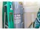 The utility room has a hot water heater and a ladder at 9845 Sweet Basil Dr, Wake Forest, NC 27587