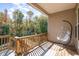 Cozy outdoor balcony area with wooden deck, scenic views, and inviting egg chair at 1001 Jarrett Bay Rd, Willow Springs, NC 27592