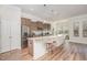 Modern kitchen featuring stainless steel appliances, granite countertops, and a large island at 1001 Jarrett Bay Rd, Willow Springs, NC 27592