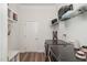 Well-equipped laundry room with modern washer/dryer, shelving, and ample storage space for convenience at 1001 Jarrett Bay Rd, Willow Springs, NC 27592