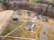 An aerial view displays the neighborhood, highlighting the home's location, landscaping, and community layout at 1001 Peterson Ridge Rd, Fuquay Varina, NC 27526