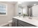 Bathroom with a double sink vanity, large mirror, and a view from the window at 1001 Peterson Ridge Rd, Fuquay Varina, NC 27526