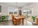 Charming dining area with a rustic wooden table, a view of the outdoor patio, and natural light at 1001 Peterson Ridge Rd, Fuquay Varina, NC 27526