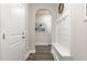 Clean hallway featuring light gray walls, decorative wainscoting and wooden floors at 1001 Peterson Ridge Rd, Fuquay Varina, NC 27526