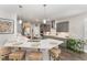 Spacious kitchen with an island, breakfast bar, gray cabinetry, and stainless steel range hood at 1001 Peterson Ridge Rd, Fuquay Varina, NC 27526