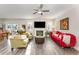 Bright living room featuring wood floors, neutral walls, comfortable seating, and a decorative fireplace at 1001 Peterson Ridge Rd, Fuquay Varina, NC 27526