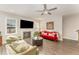 Cozy living room with fireplace, comfortable seating, natural light, and wood-style flooring at 1001 Peterson Ridge Rd, Fuquay Varina, NC 27526