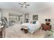 Spacious main bedroom with sitting area, ceiling fan, and neutral décor at 1001 Peterson Ridge Rd, Fuquay Varina, NC 27526