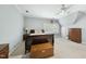View of spacious bedroom with carpet, large dresser, trunk, and a ceiling fan at 1007 Surry Dale Ct, Apex, NC 27502