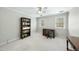 Carpeted bedroom with neutral walls and two windows is staged as an office at 1007 Surry Dale Ct, Apex, NC 27502