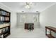 Carpeted bedroom with neutral walls and two windows is staged as an office at 1007 Surry Dale Ct, Apex, NC 27502