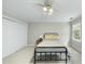 Bedroom with neutral walls, carpet, ceiling fan, and closet features a metal bed frame at 1007 Surry Dale Ct, Apex, NC 27502