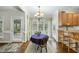 Cozy breakfast nook featuring a table, chairs, and natural lighting, adjacent to the kitchen area at 1007 Surry Dale Ct, Apex, NC 27502