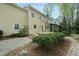 Back of the house showing an outdoor patio, a screened in porch, and lush landscaping at 1007 Surry Dale Ct, Apex, NC 27502