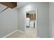 View into the hall that leads into a functional laundry room with washer and dryer at 1007 Surry Dale Ct, Apex, NC 27502