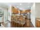 Well-equipped kitchen featuring wooden cabinets, stainless steel appliances, and bar seating, great for entertaining at 1007 Surry Dale Ct, Apex, NC 27502