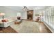 Inviting living room showcasing a brick fireplace, neutral decor, and well-lit space, perfect for gatherings at 1007 Surry Dale Ct, Apex, NC 27502