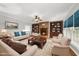 Inviting living room with a fireplace, built-in bookshelves, and comfortable seating at 1007 Surry Dale Ct, Apex, NC 27502