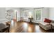 Inviting living room with hardwood floors, natural light, and a cozy seating area at 1007 Surry Dale Ct, Apex, NC 27502