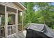 Back deck with grill and view of surrounding woods make this a great home to entertain at 1056 Lukestone Dr, Fuquay Varina, NC 27526