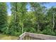 A relaxing back yard view shows mature trees surrounding this great backyard with privacy at 1056 Lukestone Dr, Fuquay Varina, NC 27526