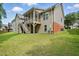 Expansive backyard showing the home's screened porch, deck, and lush green lawn at 1056 Lukestone Dr, Fuquay Varina, NC 27526