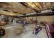 Unfinished basement with concrete flooring, exposed ceiling, and a variety of home furnishings at 1056 Lukestone Dr, Fuquay Varina, NC 27526