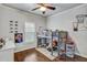 Cozy bedroom with neutral walls, showcasing a loft bed and decorative posters at 1056 Lukestone Dr, Fuquay Varina, NC 27526