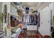 Walk-in closet with built-in shelving, hanging rods, and hardwood floors to maximize organization and storage at 1056 Lukestone Dr, Fuquay Varina, NC 27526