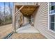 Back porch area with stairs, an exterior window, and the side of the house at 1056 Lukestone Dr, Fuquay Varina, NC 27526