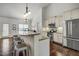 Beautiful kitchen with stainless steel appliances, granite countertops, and a large island with seating at 1056 Lukestone Dr, Fuquay Varina, NC 27526